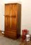 Schmaler Kleiderschrank | 2 Drehtüren | 2 Schubladen | 4 Fächer | mit Kleiderstange | 80 cm breit | Massivholz | Farbe: Eiche Abbildung
