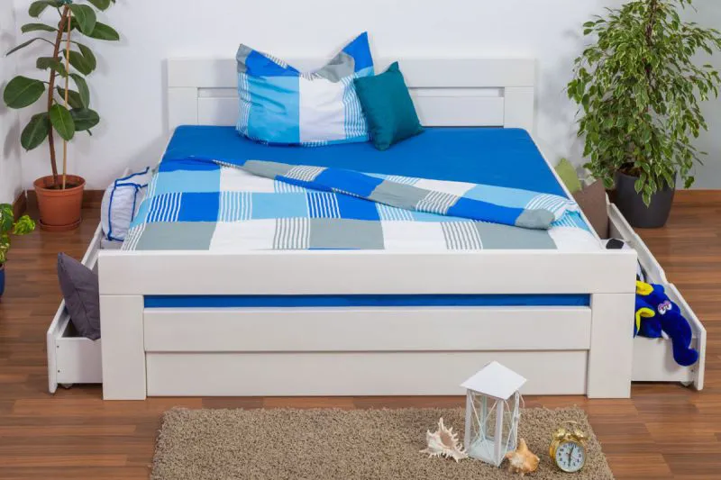 Doppelbett / Stauraumbett "Easy Premium Line" K6 inkl. 4 Schubladen und 2 Abdeckblenden 180 x 200 cm Buche Vollholz massiv weiß lackiert