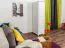 Schmaler Kleiderschrank | 1 Drehtür | 1 Schublade | mit Kleiderstange | 47 cm breit | Massivholz | Farbe: Weiß Abbildung
